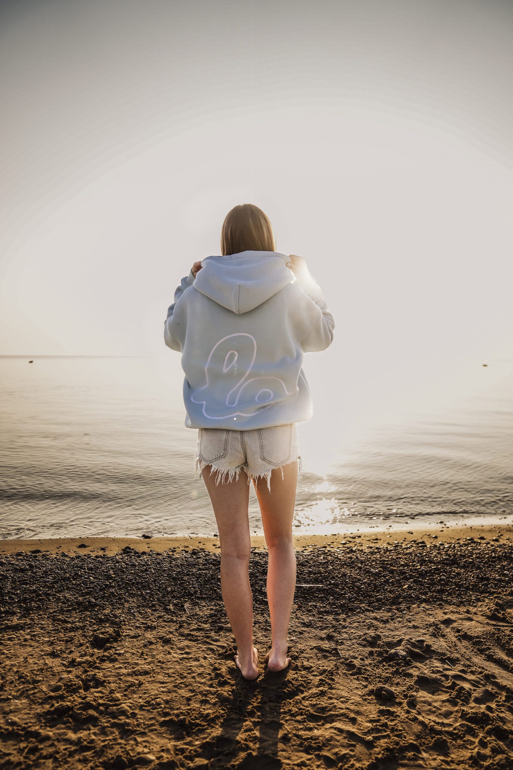 840 Lola on beach with blue hoodie